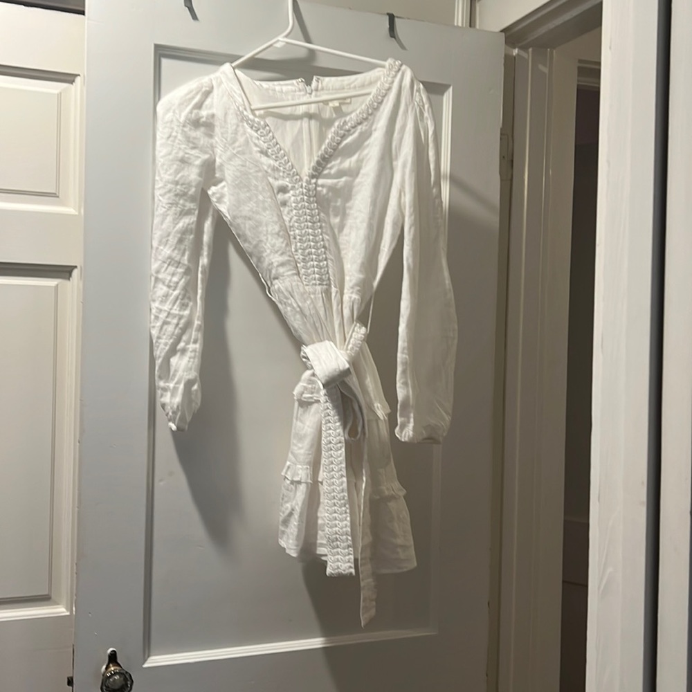 Feminine white Roller Rabbit wrap dress.